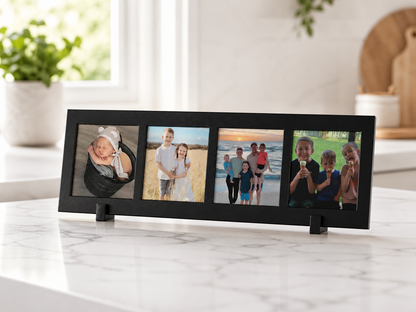 Black multi-picture frame with family photos on a marble surface