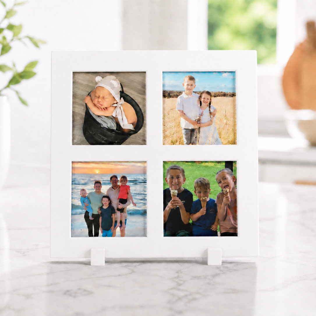 White photo frame with multiple family photos on a marble surface